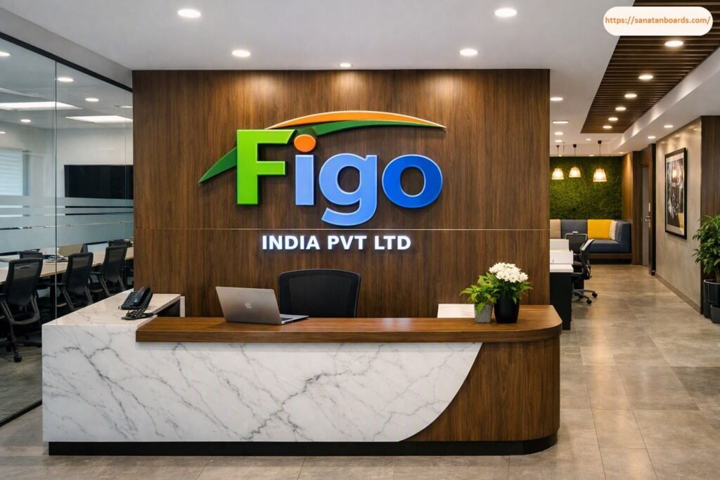 Modern office reception desk featuring white marble and wooden paneling, set in front of a wood-paneled feature wall with the colorful green and blue 3D logo and lettering for Figo INDIA PVT LTD.