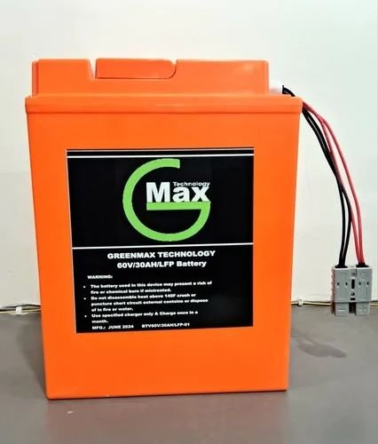 An orange 60V 30AH Lithium Iron Phosphate battery pack manufactured by Green Max Technology, complete with connected power wiring and a gray terminal plug.