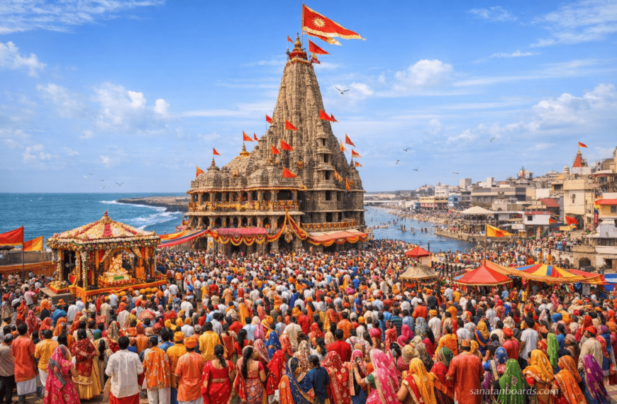 Wide-angle view of Dwarkadhish Temple in Dwarka, Gujarat, with devotees celebrating Janmashtami. Watermark: sanatanboards.com